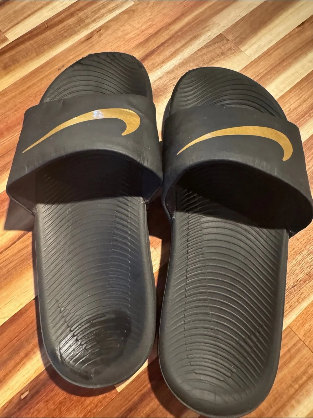 Nike Black Slide Sandals with Gold Swoosh - Kids